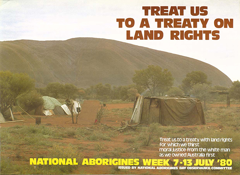 A colour poster issued to promote NAIDOC week in 1980. Features a photograph of a camp site with humpies (or gunyahs) with Uluru (Ayers Rock) in the background.