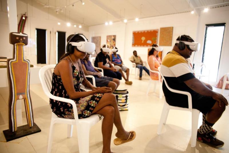 People sitting with VR headsets on