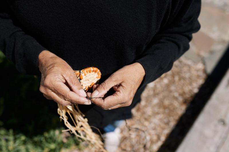 two hands weaving
