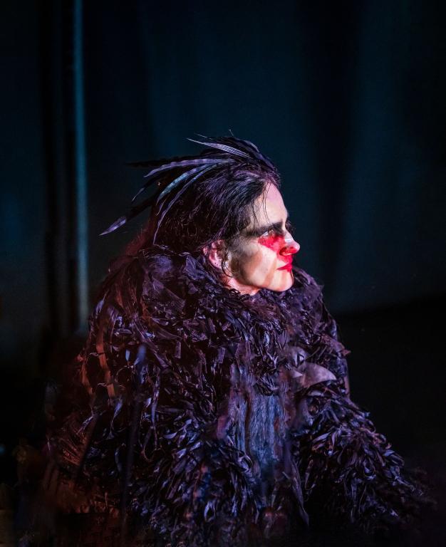 A man in animal dress and make up