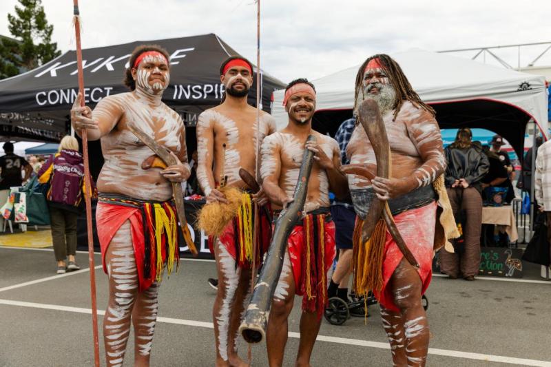 4 men in traditional dance and paint dress